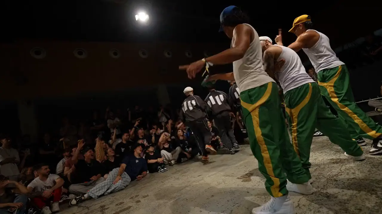 A crew on the floor in front of a seated audience