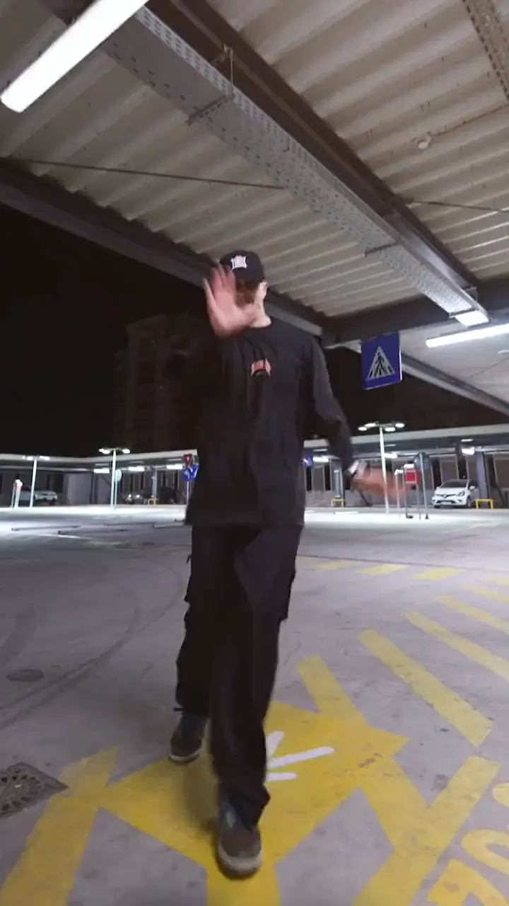 Niki shuffling at night in a multi-storey car park